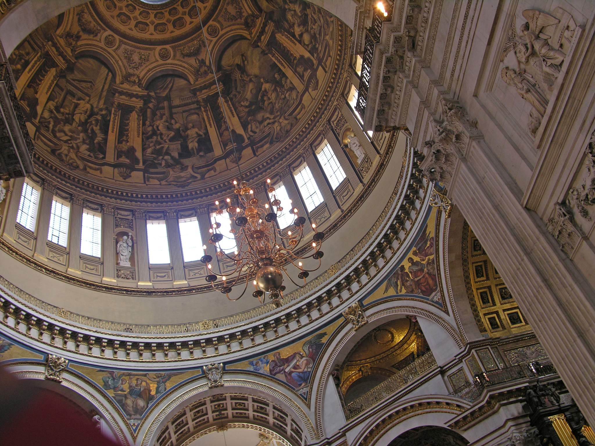 London St. Pauls Cathedral 07 Dome The St. Paul�s Cathedral altar sits beneath Wren�s great dome, which he conceived as an observatory linking heaven and earth. Statues portray doctors of both western and eastern churches. The Whispering Gallery is visible circling under the dome. We climbed 30m to the Whispering Gallery in St. Paul�s Cathedral, where a whisper on one side can be heard 32m away on the other. The security guard was very diligent at not allowing any photos to be taken.